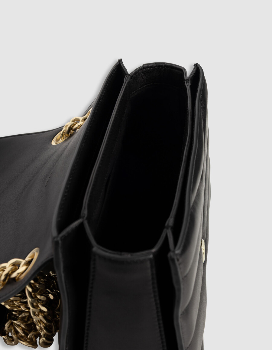damestas van zwart leer maat m met goudkleurige metalen details.